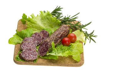 Salami with rosemary, salad and tomatoes