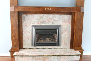 Gas fireplace with granite and wood trim