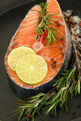 Fresh salmon steak on pan, close up