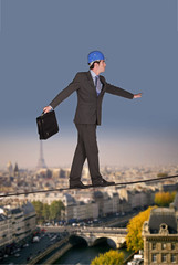 Businessman walking on a tightrope