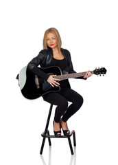 Sexy guitarist sitting with a black leather jacket