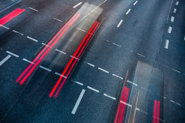Motion blurred city road traffic (color toned  image)
