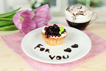 Sweet cake with blackberry and chocolate sauce