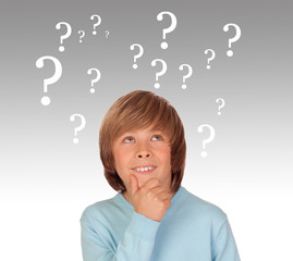 Doubtful preteen boy with many question symbols