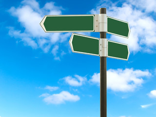 Road sign against the blue sky