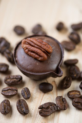 Vertical shot of a french petit four and roasted coffee beans