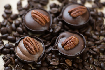 Petits fours and roasted coffee beans, studio shot