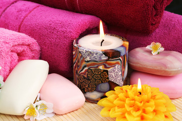 Towels, soaps, flowers, candles