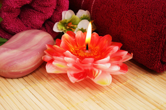 Towels, soap, flowers, candle
