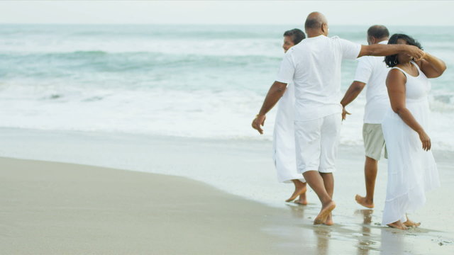 Happy Ethnic Seniors Beach Vacation