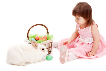 little girl playing with fur eatser rabbit