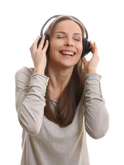 Young woman listening music with headphones