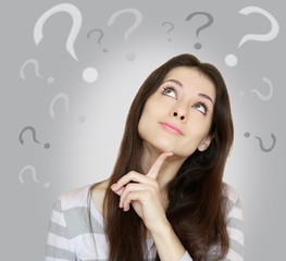 Beautiful girl with questioning thinks  and question marks above