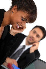 office workers talking on their cell phones