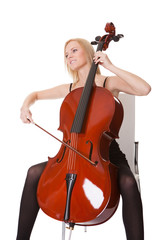Beautiful young woman playing cello © Andrey Popov