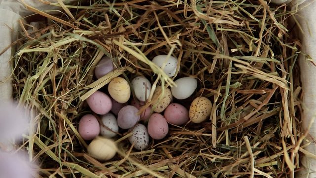 Sugar easter eggs falling in the straw