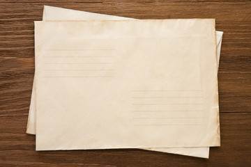 old postal envelope on wood