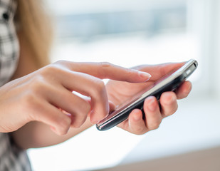 A woman uses a mobile phone