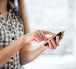 A woman uses a mobile phone