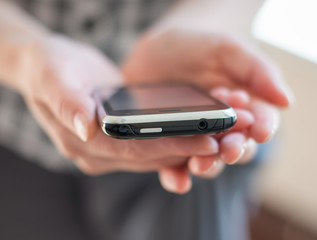 A woman uses a mobile phone