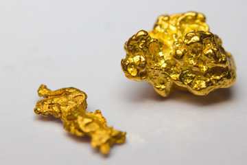 Close-up of two gold-nuggets