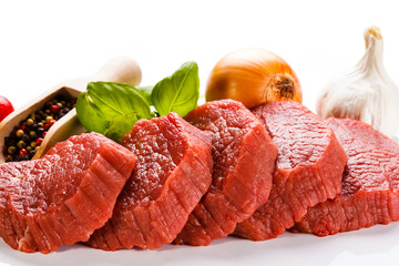 Raw beef and vegetables on white background