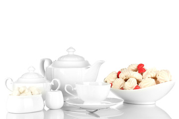 Beautiful white dinner service with an air meringues isolated