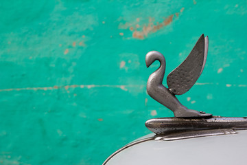 Close-up of a hood ornament of an antique car - Powered by Adobe