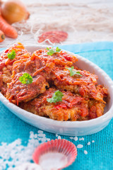 fish in Greek kind with vegetables and tomato sauce