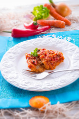 fish in Greek kind with vegetables and tomato sauce