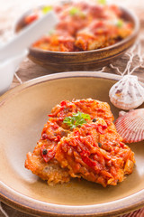 fish in Greek kind with vegetables and tomato sauce