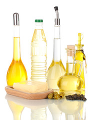 Different types of oil with sunflower seeds and olives isolated