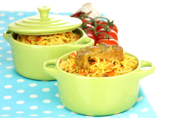 Delicious pilaf with vegetables isolated on white