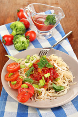 Tasty spaghetti with sauce and vegetables