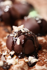 Chocolate candies with nuts, close up