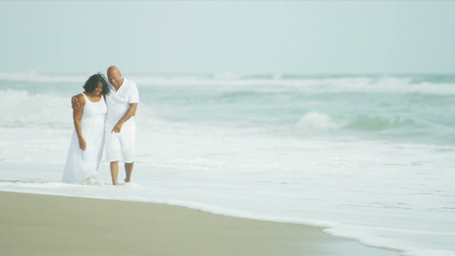 Contented Senior Ethnic Couple Quiet Beach Time