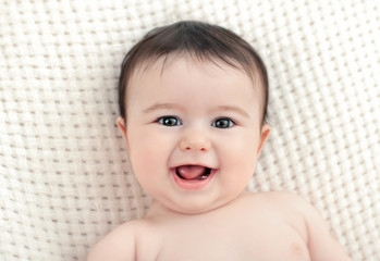 portrait of a baby who smiles