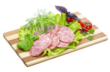 Sausages with salad and basil