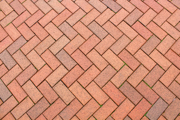 Red brick paving stones on a sidewalk - Powered by Adobe