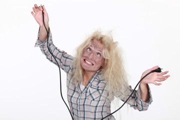 Woman getting an electric shock