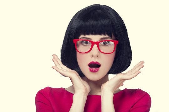 girl in red glasses at white background.