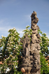 Fototapeta na wymiar Statue St. Cajetan on Charles bridge in Prague, Czech republic