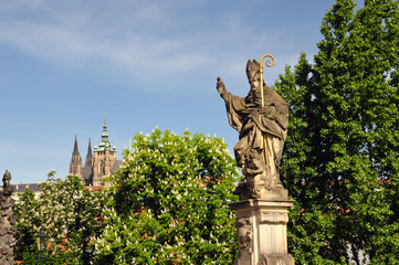 Fototapeta na wymiar Saint Augustine statue holding, Charles Bridge Prague
