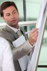 Fototapeta premium Male executive writing