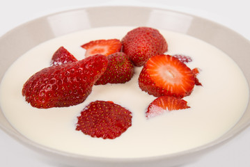 sliced ​​red ripe strawberries in a bowl
