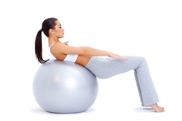 Fototapeta na wymiar Doing abdominal muscles with fitness ball