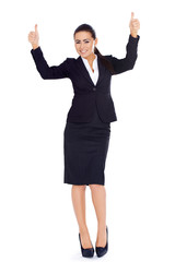 Business woman standing and showing thumbs up gesture