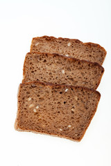 Slices of dark bread isolated over white