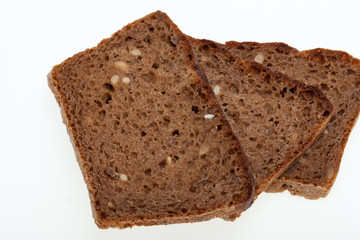 Slices of dark bread isolated over white