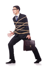 Businessman tied up with rope on white